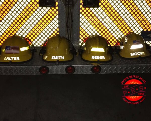 A group of yellow helmets on top of a rack.