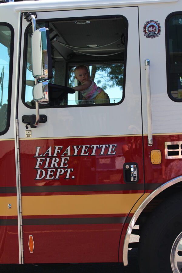 Lafayette fire truck with child inside.