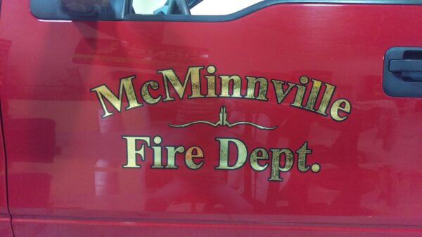 McMinnville Fire Department logo on red truck.